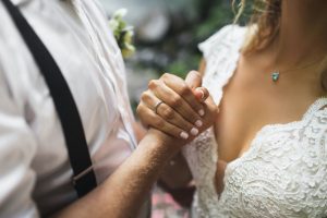 Bride and groom holding hands while planning their wedding